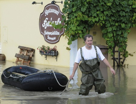 8 die in floods, central Europe on alert
