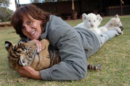 Woman shares home with 11 wild cats in S Africa