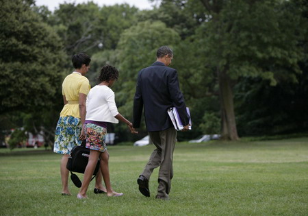 us president barack obama walk with first lady michelle obama and ...