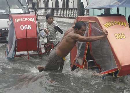 Tropical storm 'Seven' floods Manila streets