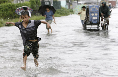 Tropical storm 'Seven' floods Manila streets