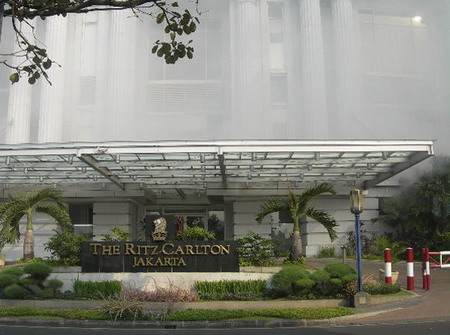 Smoke billows out of the Ritz-Carlton Hotel following a blast in ...