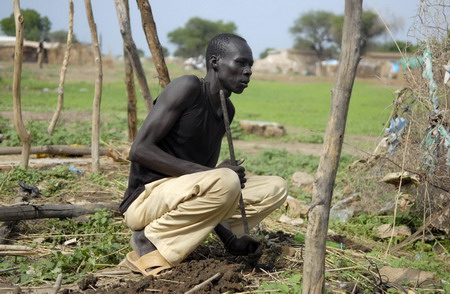 Men after a loot in Abye, Sudan