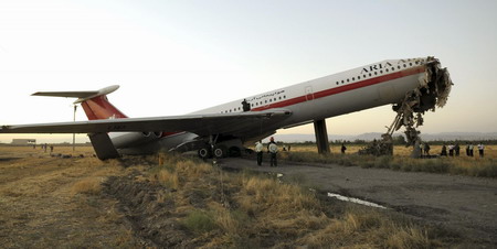 Plane hits wall at Iranian airport, killing 17