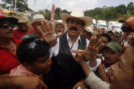 Ousted Honduran leader returns home - briefly