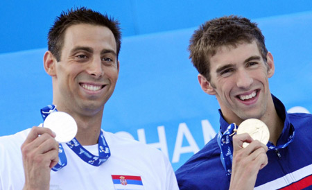 Phelps reels in Cavic to stay butterfly king in Rome