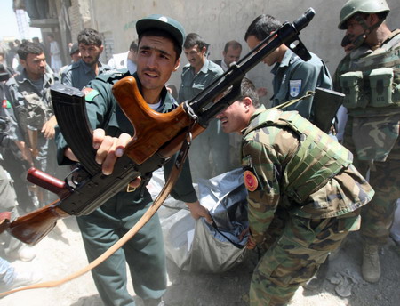 Officials: Attacks kill 26 on Afghan election day