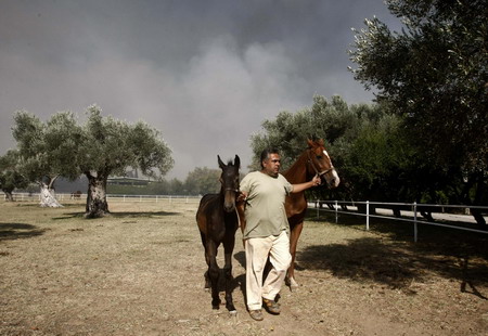 Wildfires in Greece mostly under control