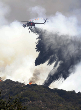 Calif. firefighters wage fierce wildfire battles