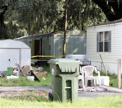 7 found slain at US mobile home, 2 badly hurt