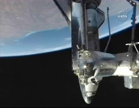 Shuttle Discovery arrives at space station