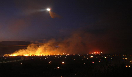LA wildfire threatens 12,000 homes; 2 dead