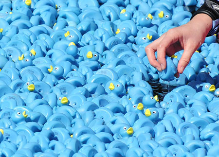 Paddle among thousands of plastic ducks on Thames