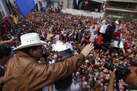 Ousted leader returns to Honduras, defies arrest