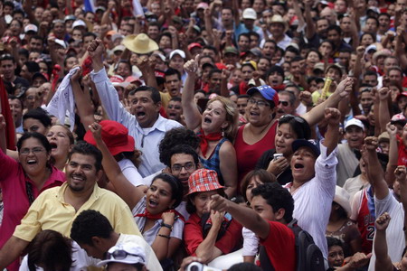 Ousted leader returns to Honduras, defies arrest