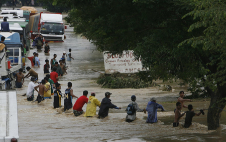 Rain, floods in N. Philippines kill over 100