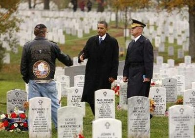 Obama honors veterans at Arlington cemetery