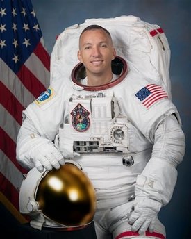 Astronaut's wait over as daughter born back home