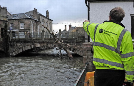Residents tidy homes up as flood fades away in UK