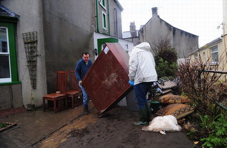 Residents tidy homes up as flood fades away in UK