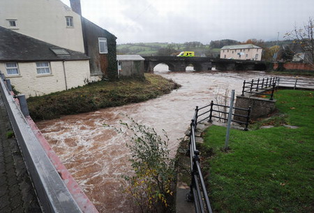 Residents tidy homes up as flood fades away in UK