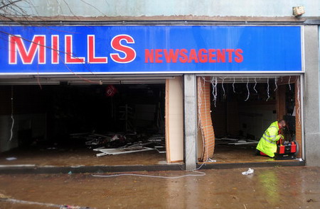 Residents tidy homes up as flood fades away in UK