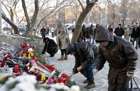Russia mourns as nightclub fire victims are buried
