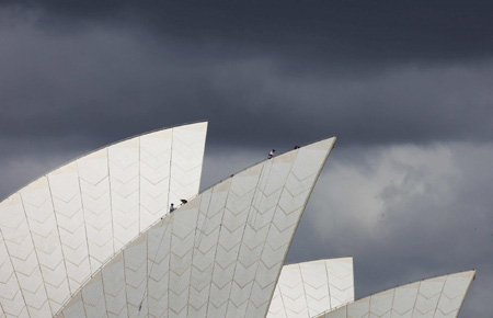 Activists climb Opera House for climate protest