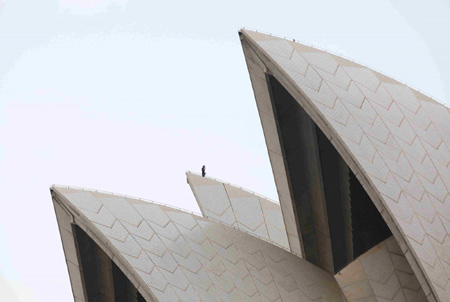 Activists climb Opera House for climate protest
