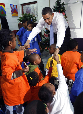 Obama reads story, gives cookies to children