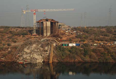  ... trapped after a bridge under construction collapsed in western India