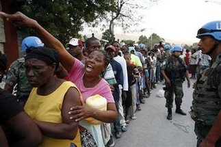 Haiti says 200,000 may be dead, violence breaks out