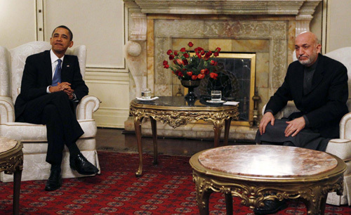 In surprise visit to war zone, Obama prods Afghans