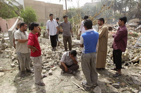  around a man mourning the loss of his relatives after a bomb attack ...