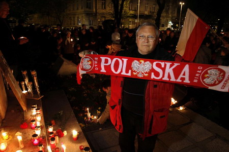 People mourn the late Polish president