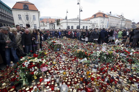 People mourn the late Polish president