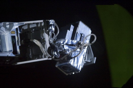 Spacewalk hit by brief power outage, no danger