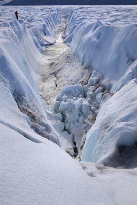 Huge ice island carves off Greenland glacier