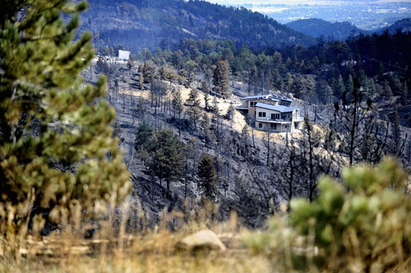 Wind fuels wildfire sweep in Colorado