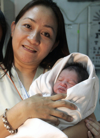 Philippines searches for mother of newborn left in plane