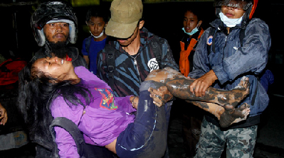 Deaths from Indonesian volcano hit 92, rescue continues