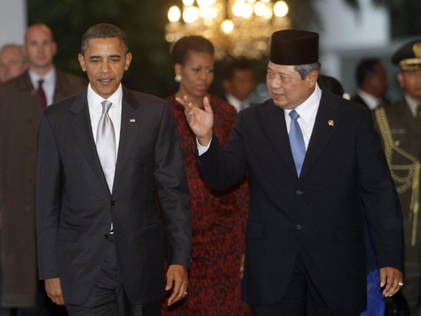 Obama warms Indonesia ties; volcano may cut trip