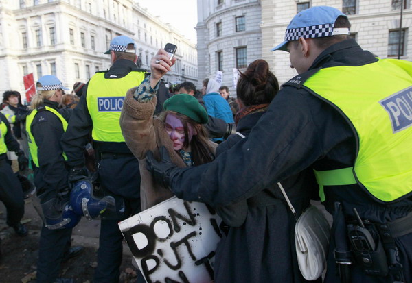 Students, police clash as UK debates tuition hike