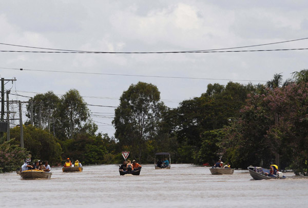 Australian city cut off by floods braces for more