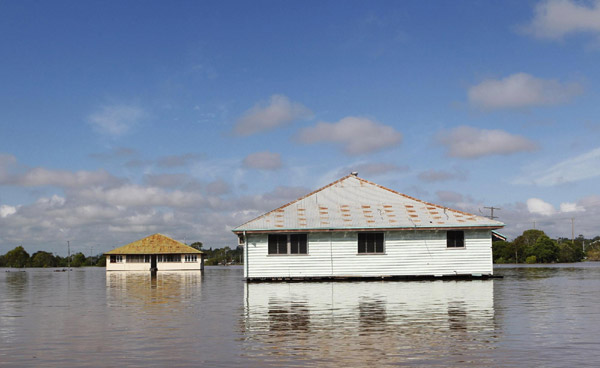 Australian city cut off by floods braces for more