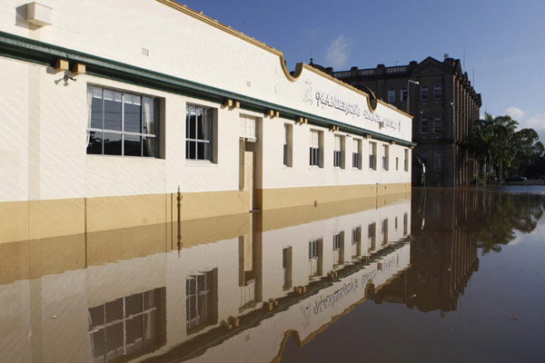 Australian city cut off by floods braces for more