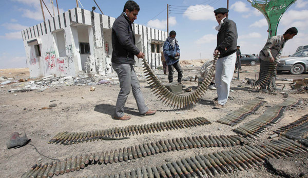 Libyan army forces rebels to retreat; FM defects