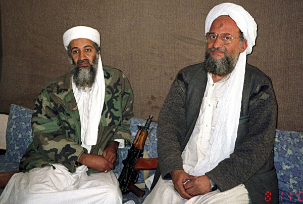 Osama in Laden L sits with. Osama bin Laden (L) sits with