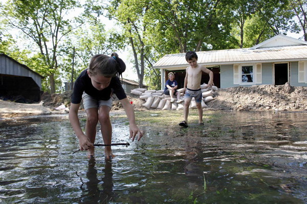 Floodwaters rise in the poverty-stricken Delta