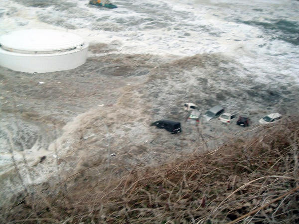 Cars are washed away by a tsunami at Tokyo Electric Power Co. (TEPCO)'s Fukushima Daiichi nuclear power plant in Fukushima Prefecture, in this handout photo taken from near its No. 5 reactor on March 11 and released by TEPCO on May 19, 2011. Water rushes into Fukushima nuke power plant